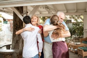 discretionary trust, image of grandparents hugging young adult grandchildren