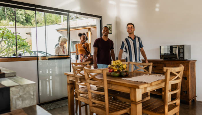 Navigating Tax Issues With Vacation Property Rentals Group of people entering a vacation home