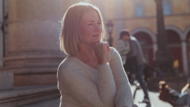 Can You Disinherit a Spouse in California, image of pensive middle-aged woman outside