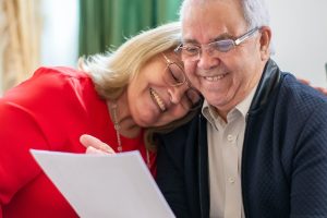 What Happens to Your Business When You Die, image of senior couple perusing a document