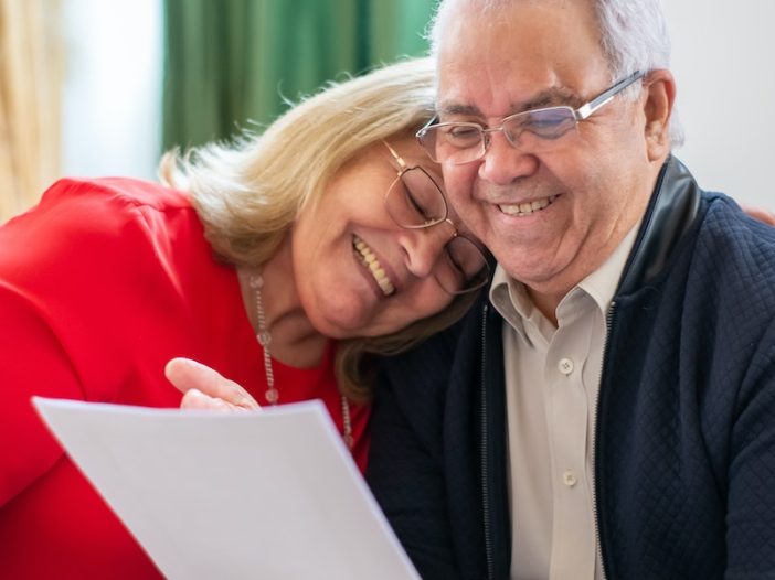 What Happens to Your Business When You Die, image of senior couple perusing a document
