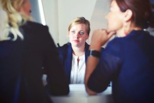 Can You Turn Down an Inheritance, image of a woman at a meeting