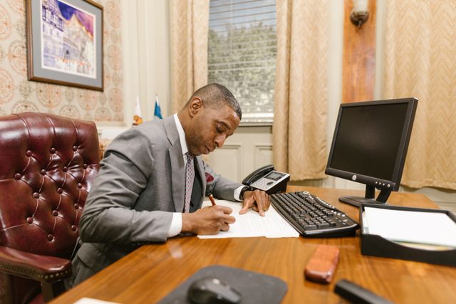 revocable living trust, image of a man working in an office